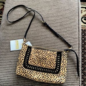 Leopard print fur and black leather small purse.